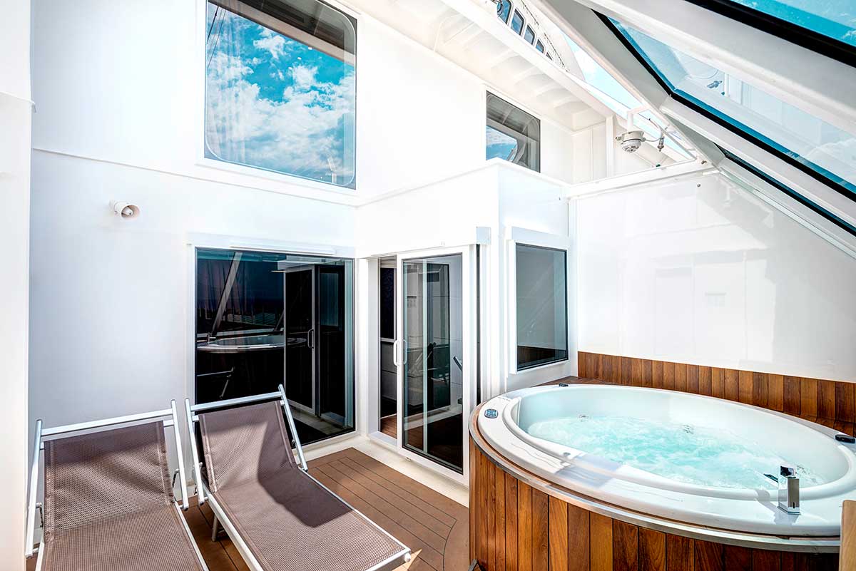 Image of a suite cabin on a cruise ship with a hot tub