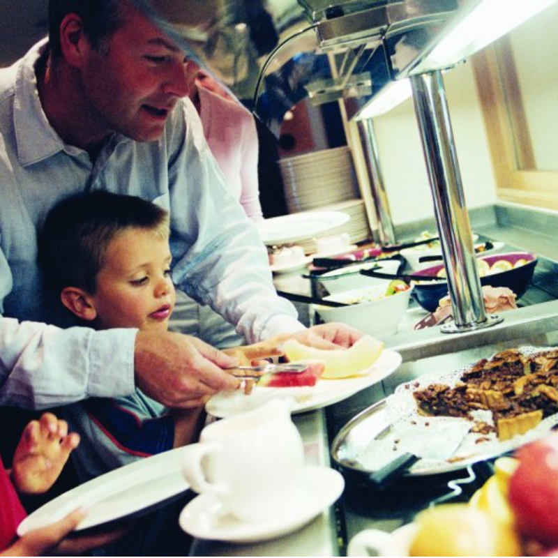 A family enjoying the buffet on a cruise