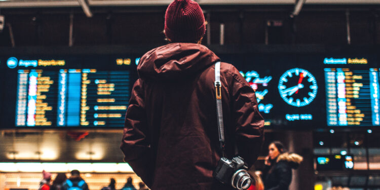 Man looking up at departure screen