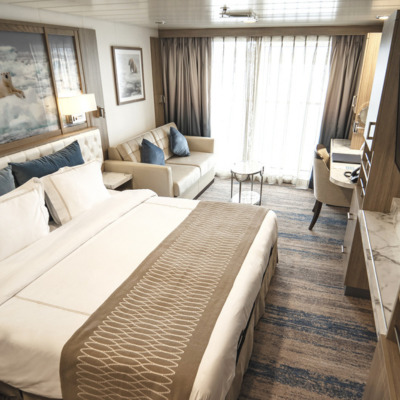 Balcony stateroom onboard Greg Mortimer