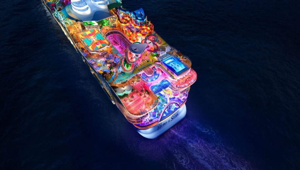 Hero of the Seas illuminated at night with pools and waterpark glowing at sea