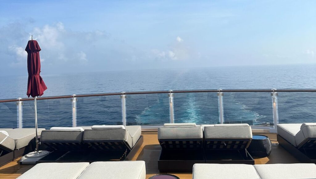 The Haven private sundeck on Norwegian Luna with luxury loungers overlooking the ocean