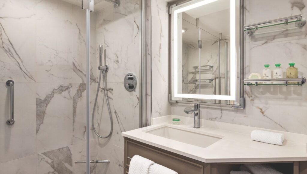 oceania marina refurbished bathroom with marble and rainfall shower