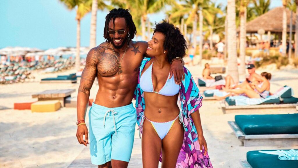adult only cruise couple walking on beach resort Caribbean