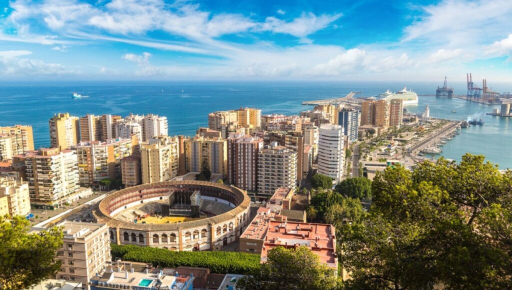 Aerial view of Malaga's bullring, skyline and cruise port, a Spanish port of call on the Azamara Iberian cruise itinerary