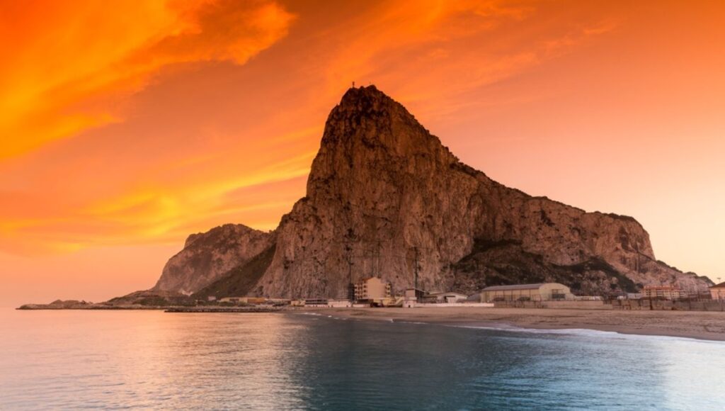 The Rock of Gibraltar glowing at sunset, a port of call on the Azamara Seville to Lisbon cruise itinerary