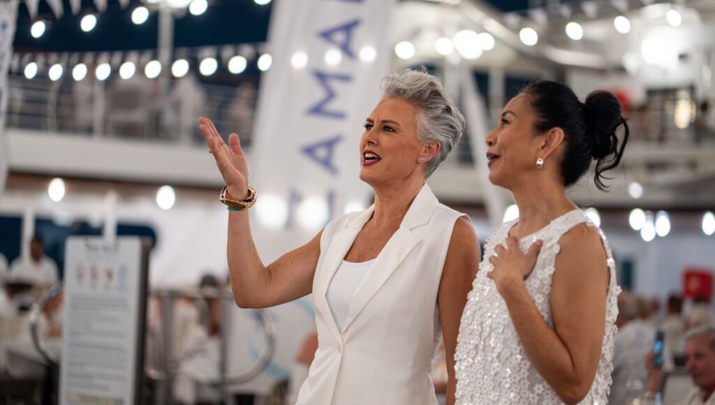 Guests dressed in white at the Azamara White Night onboard event during a Mediterranean cruise on Azamara Journey