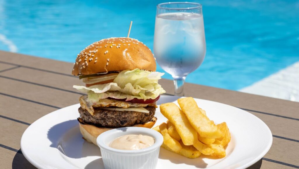 Burger and fries by the pool at The Patio on Azamara