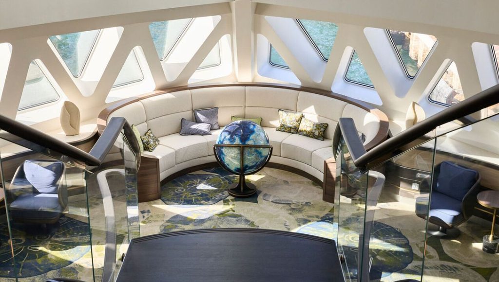 The Citizen Science Center & Lounge on Douglas Mawson, with curved seating and a globe beneath the X-BOW windows