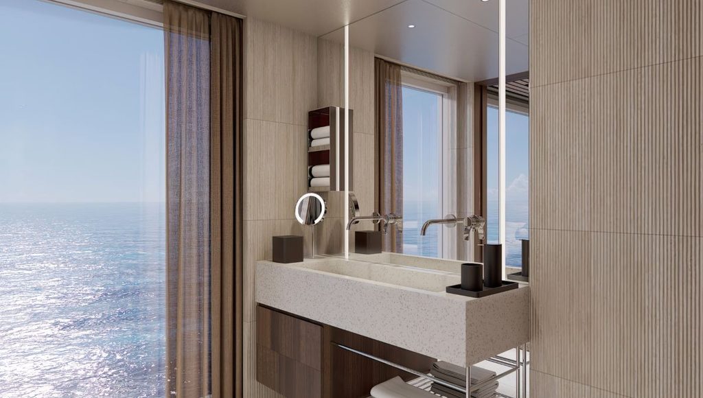 Haven Duplex suite bathroom on Norwegian Bella with a stone basin and floor to ceiling ocean views