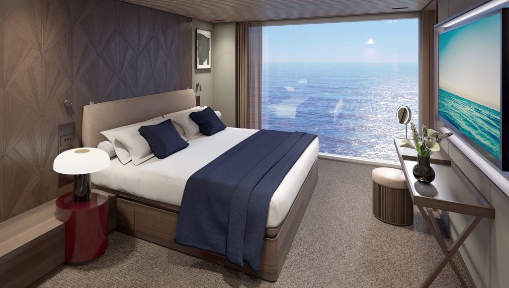 Haven Duplex suite bedroom on Norwegian Bella with a panoramic ocean view window