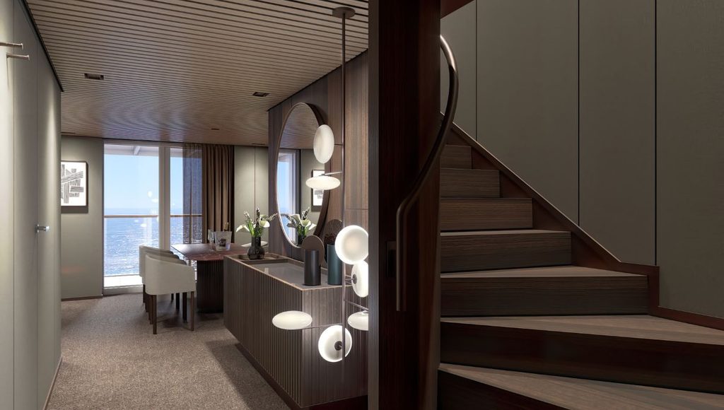Haven Duplex suite entrance on Norwegian Bella with a private staircase and dining area