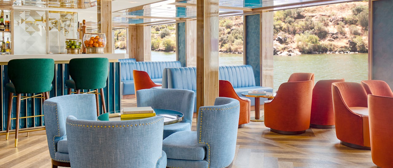Grab a cocktail from the bar and relax to stunning river views outside the floor-to-ceiling windows