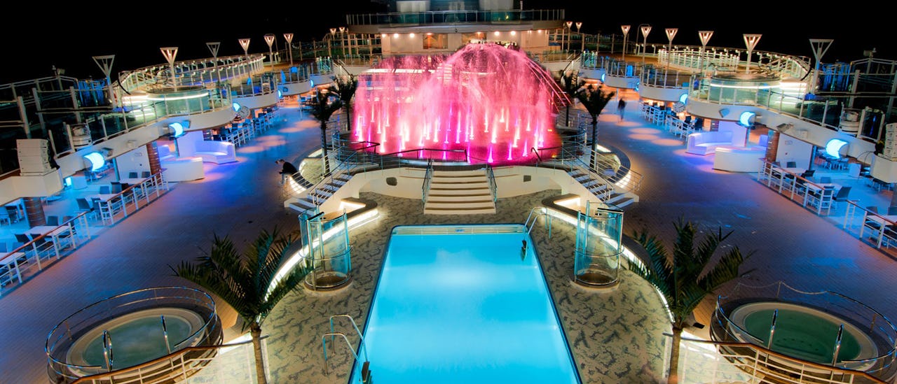 Watch a film under the stars on the pool deck