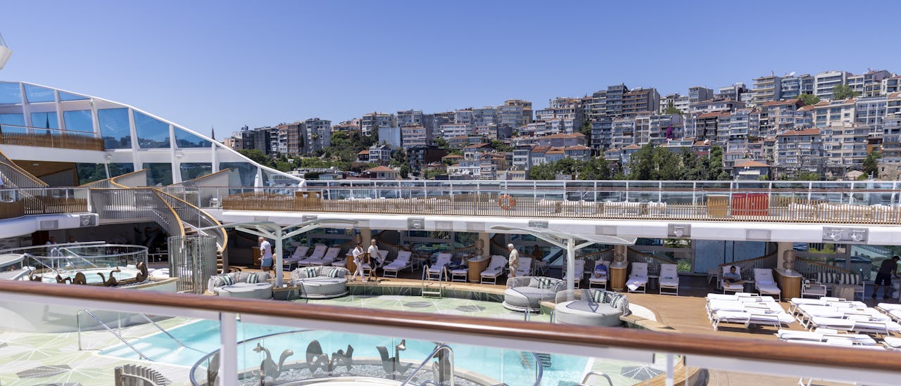 Oceania Vista’s Pool Deck reflects the beauty of the surrounding sea.