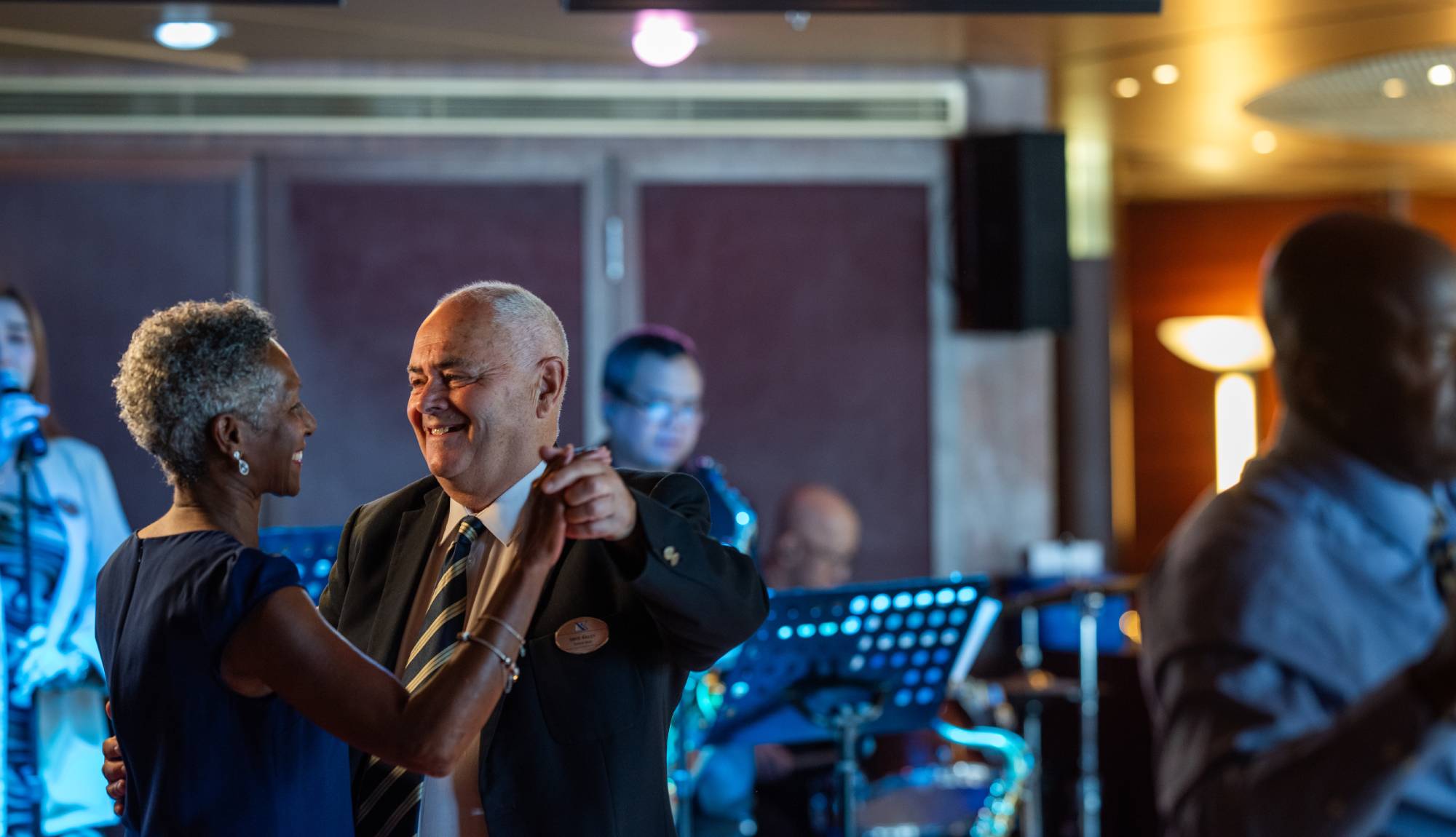 Fred. Olsen Cruise Lines Solo Cruising - Solo Guest Dancing with Dance Hosts in Ocean Bar