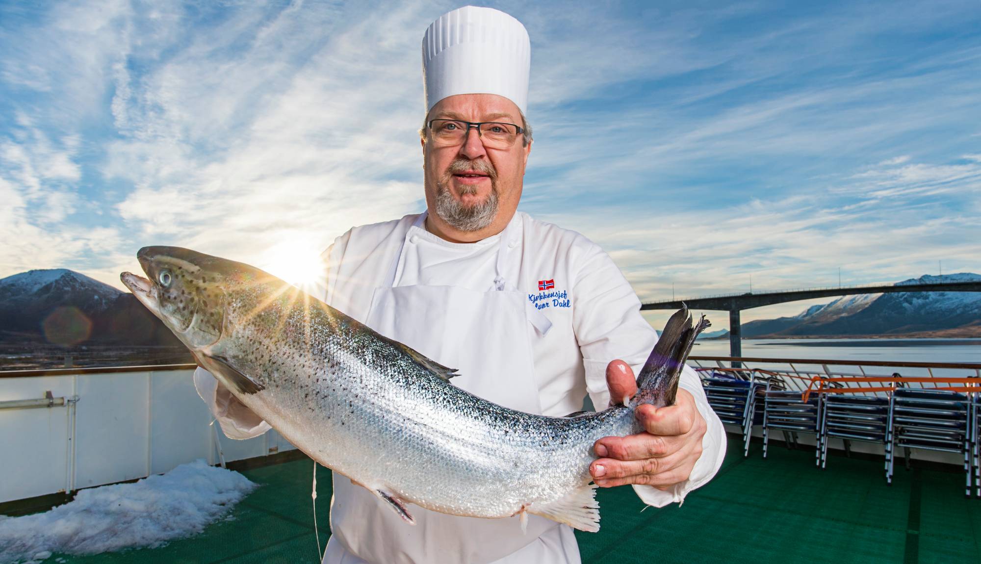 Hurtigruten Dining - Chef with a fish on deck