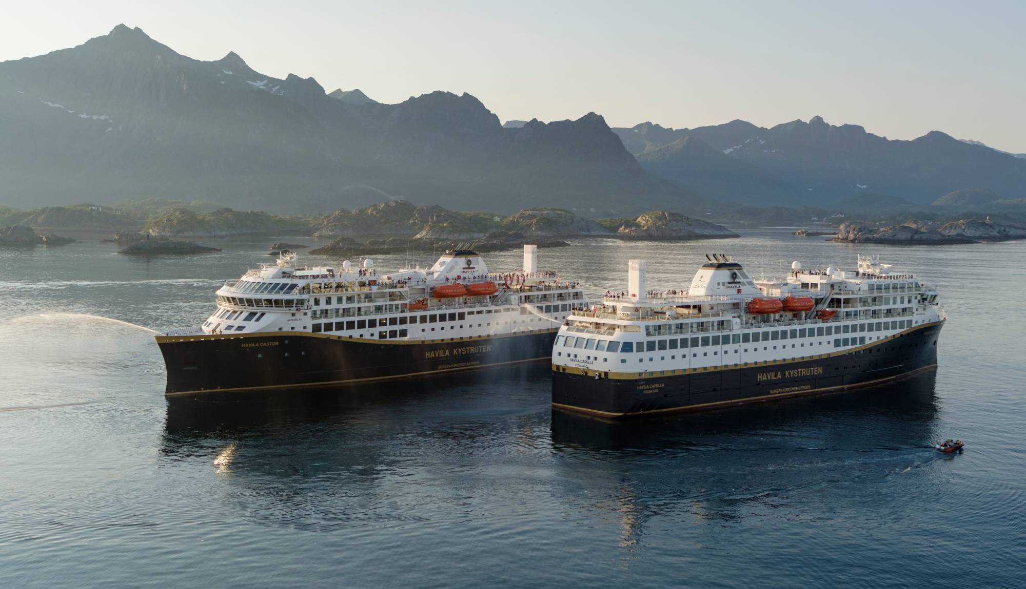 Havila Voyages - Havila Castor and Havila Capella sailing past each other