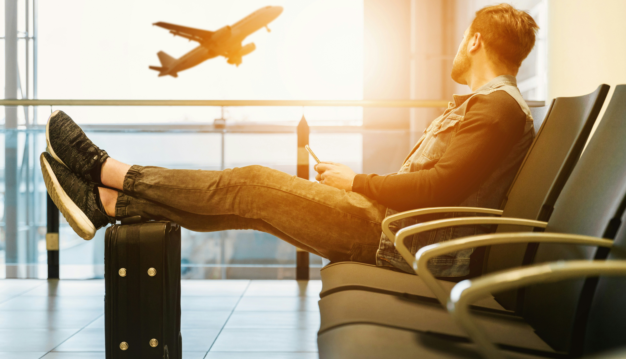 Man waiting for a flight at an airport