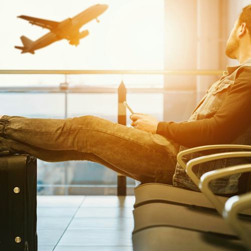 Man waiting for a flight at an airport