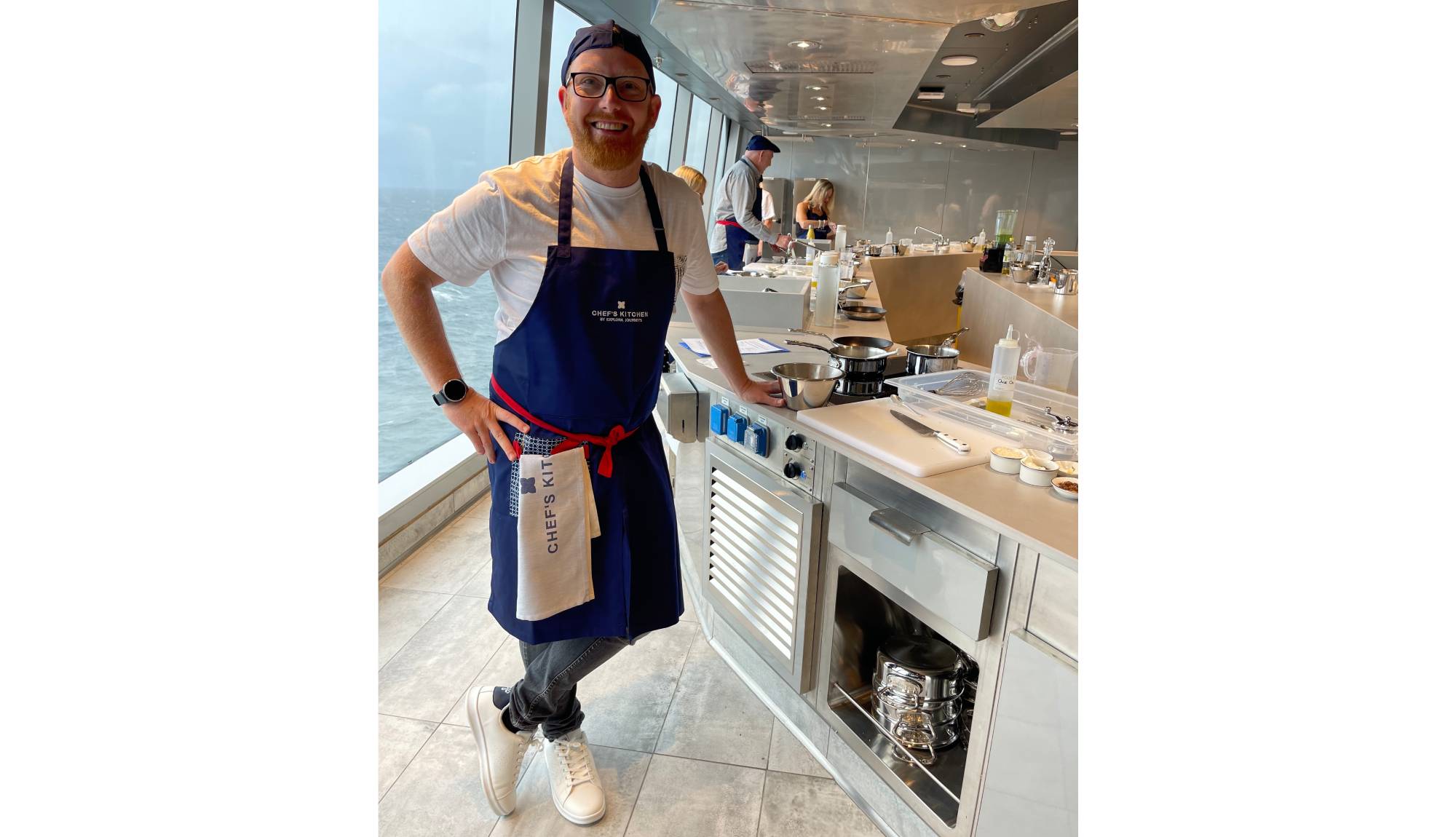 Marco experiences the Chef’s Kitchen aboard Explora Journeys, preparing dishes alongside the onboard culinary team in its intimate ocean-front cooking school.
