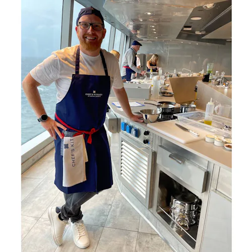 Marco experiences the Chef’s Kitchen aboard Explora Journeys, preparing dishes alongside the onboard culinary team in its intimate ocean-front cooking school.