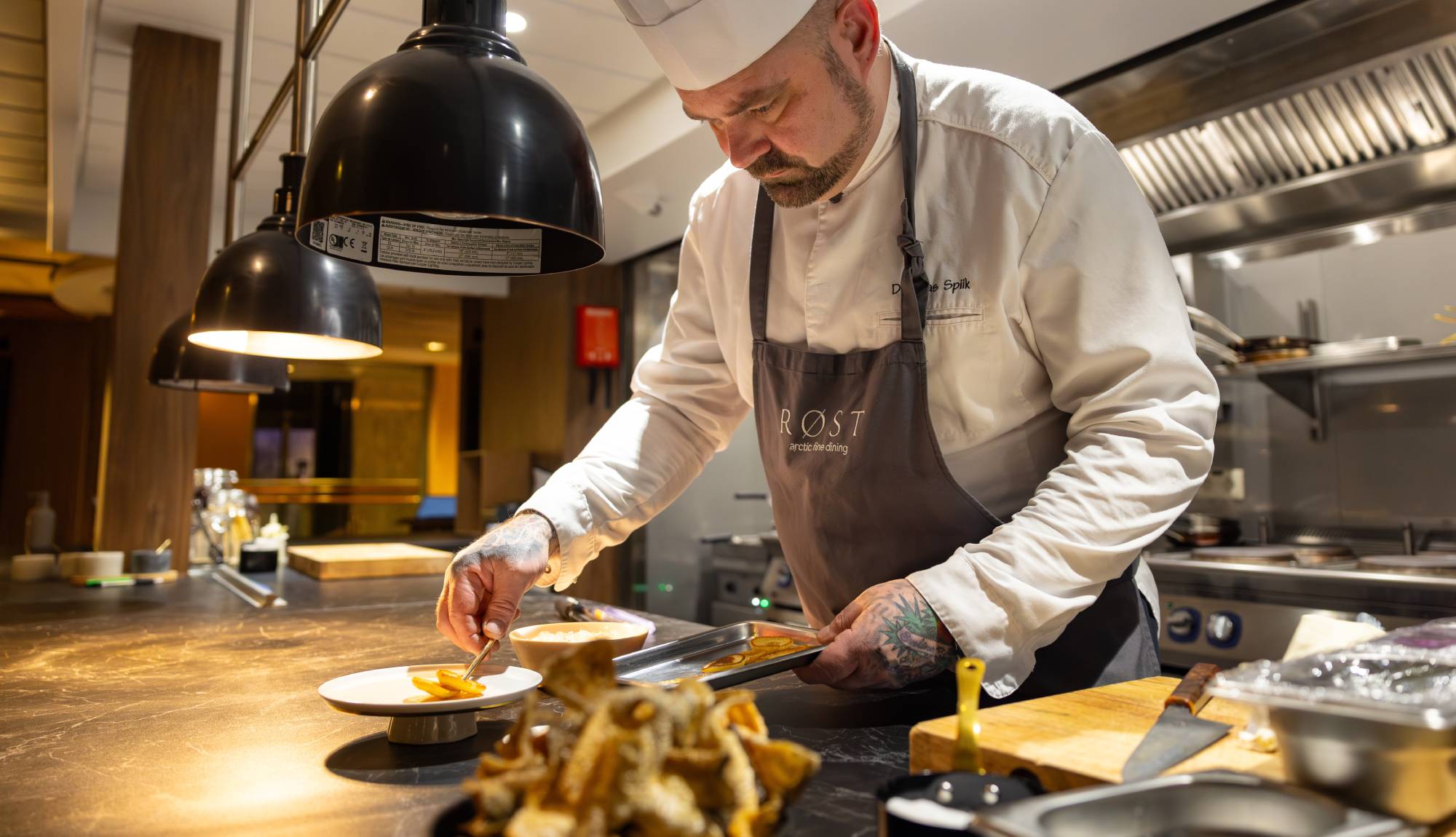 Hurtigruten Dining - Chef at Røst prepering food