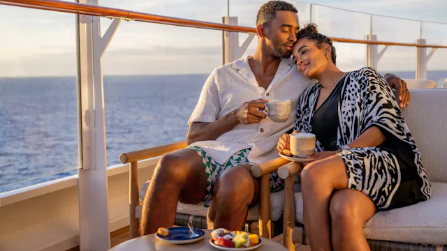 Disney Cruise Line - Adult Cruises - Guests enjoying a coffee on deck