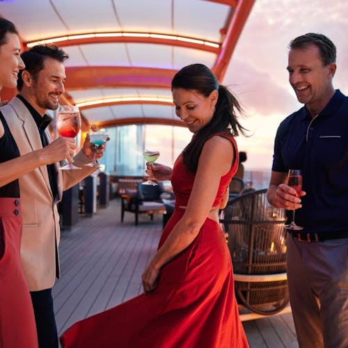 People enjoying drinks on the Magic Carpet