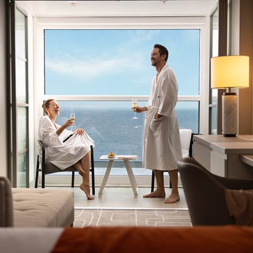 Couple enjoying champagne on their infinite veranda