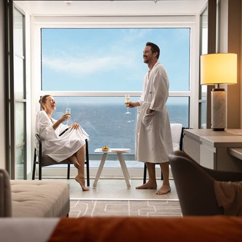 Couple enjoying champagne on their infinite veranda