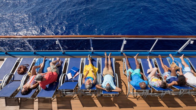 Guests relaxing on top deck with ocean views