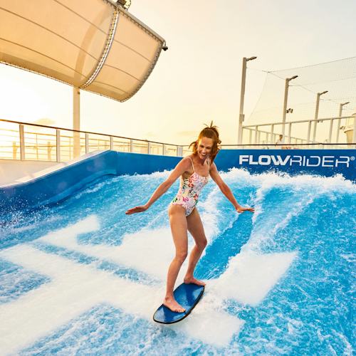 Guest enjoying the FlowRider onboard Wonder of the Seas