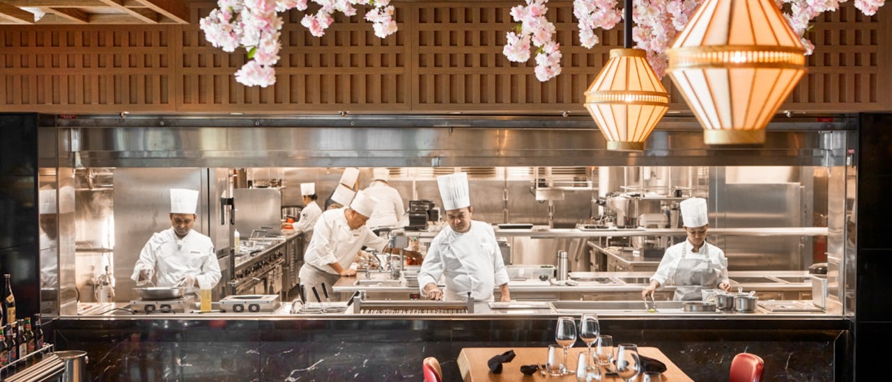 Chefs preparing the menu at Sakura onboard Explora Journeys