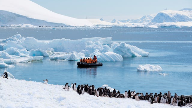 Guests onboard a Zodiac in Antarctica