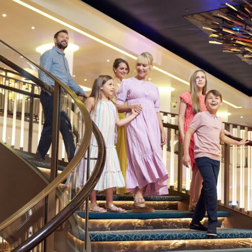 Family walking into the Atrium onboard