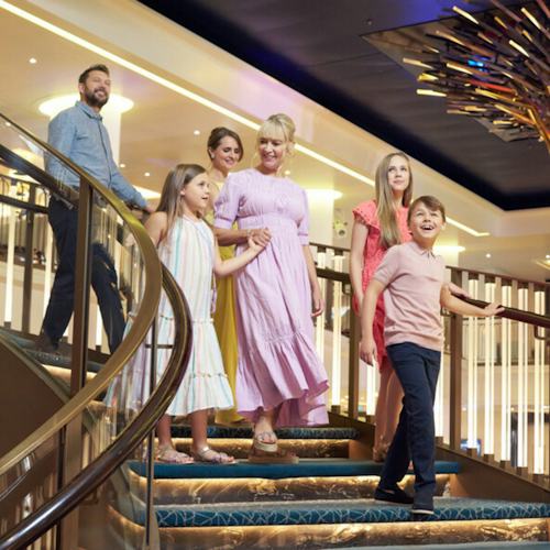 Family walking into the Atrium onboard