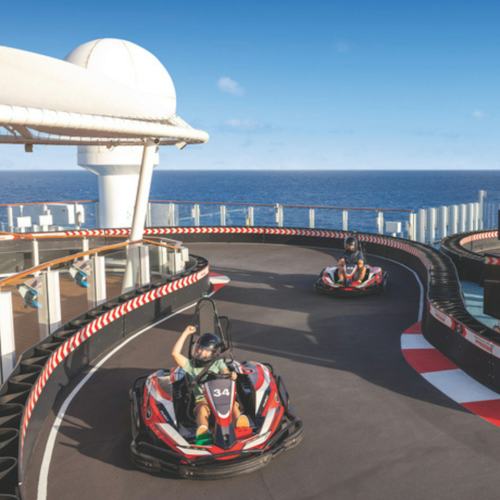 Guests driving go-kart on NCL Encore Speedway