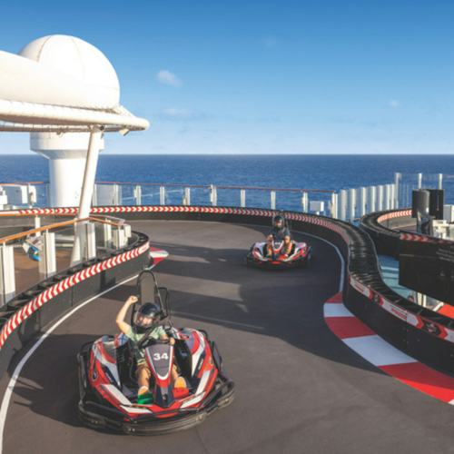 Guests driving go-kart on NCL Encore Speedway