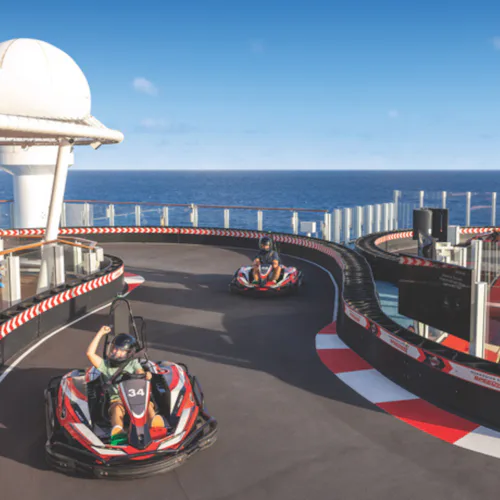 Guests driving go-kart on NCL Encore Speedway