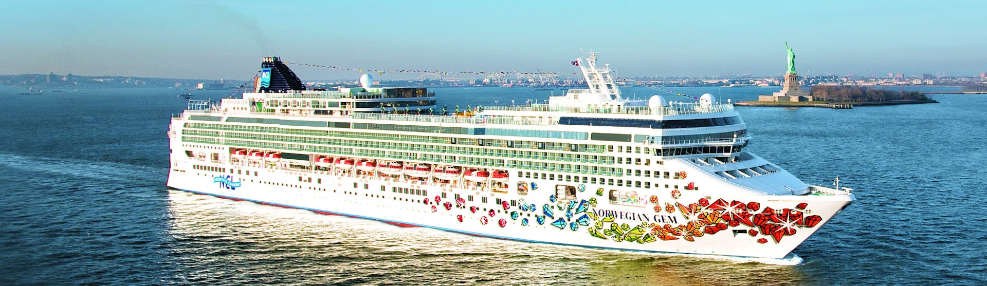 Norwegian Gem sailing past the Statue of Liberty