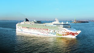 Norwegian Gem sailing past the Statue of Liberty