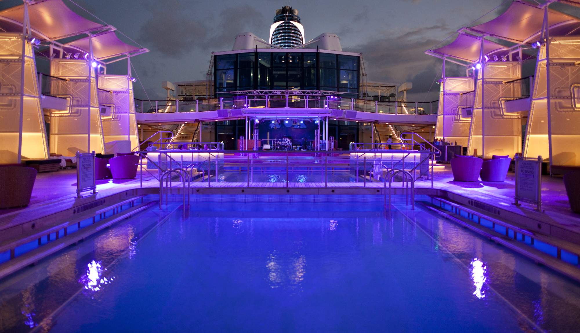Pool deck onboard Celebrity Cruises ships at night