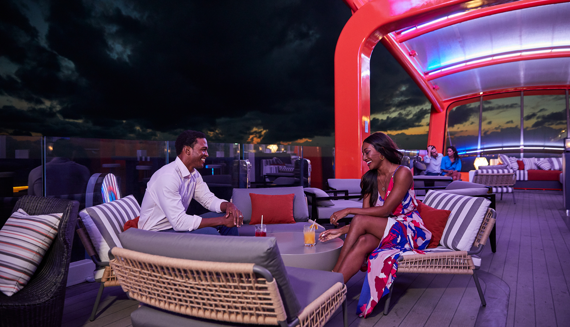 Couple enjoying drinks on the magic carpet