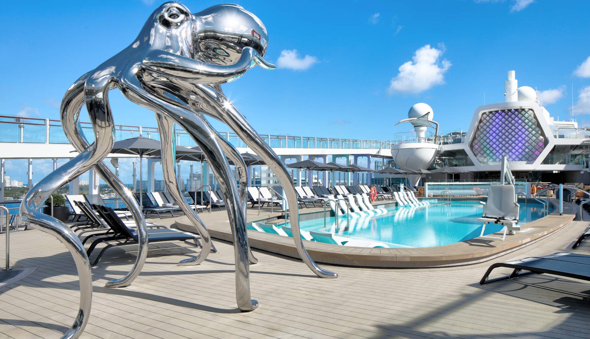 Pool deck on Celebrity Beyond with iconic sculpture