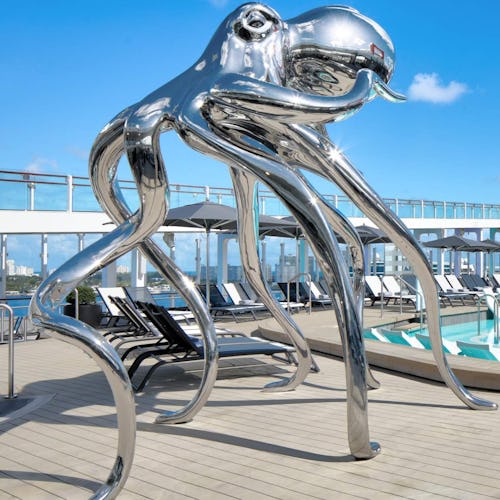 Pool deck on Celebrity Beyond with iconic sculpture