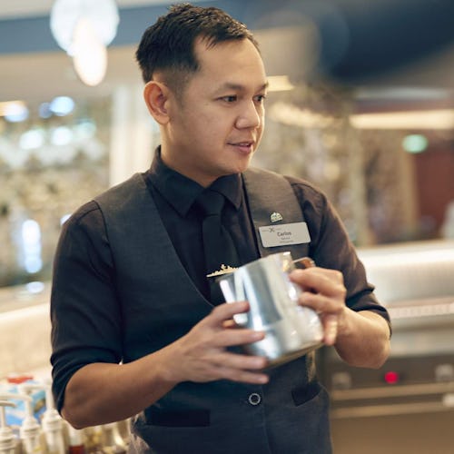 Barista serving coffee at Cafe Al Bacio