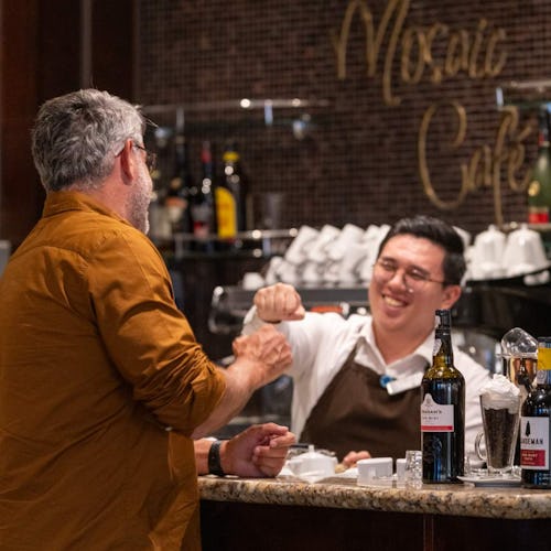 Barman interacting with guest at Mosaic Cafe