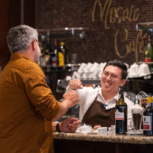 Barman interacting with guest at Mosaic Cafe