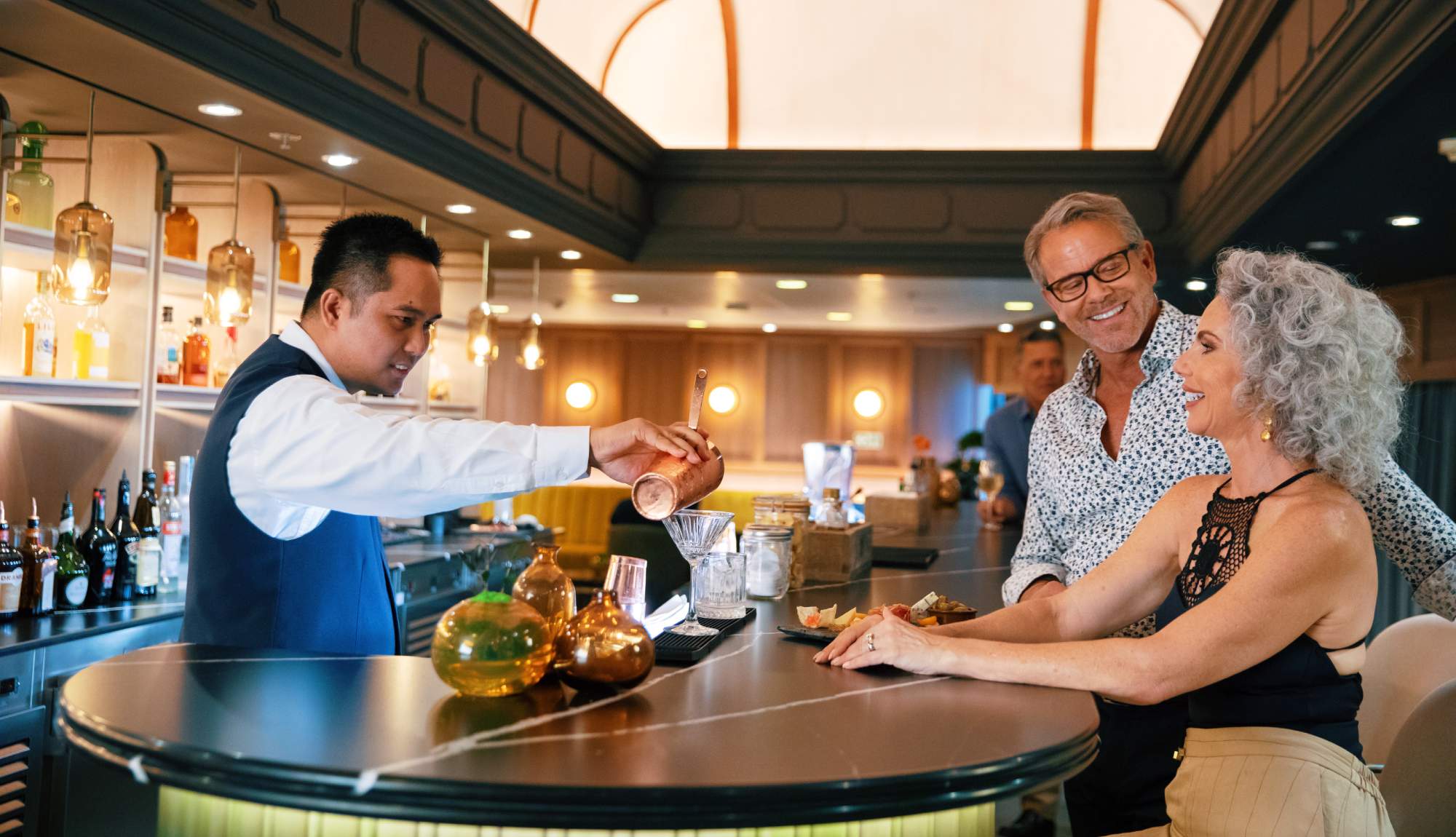 Couple enjoying cocktails in the Atlas Bar